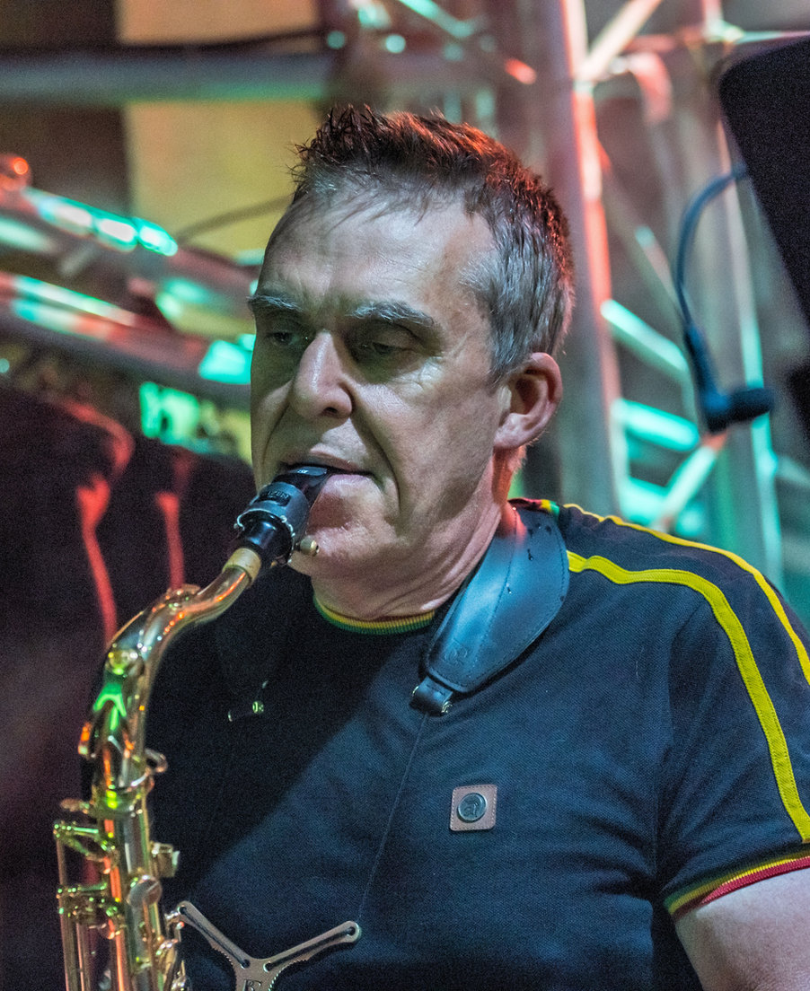 Steve Randell playing saxophone on stage